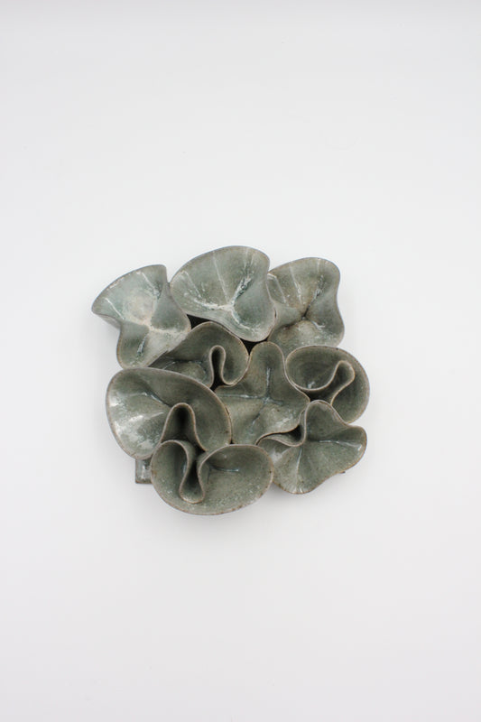 Vägghängd skulptur, Piggelin